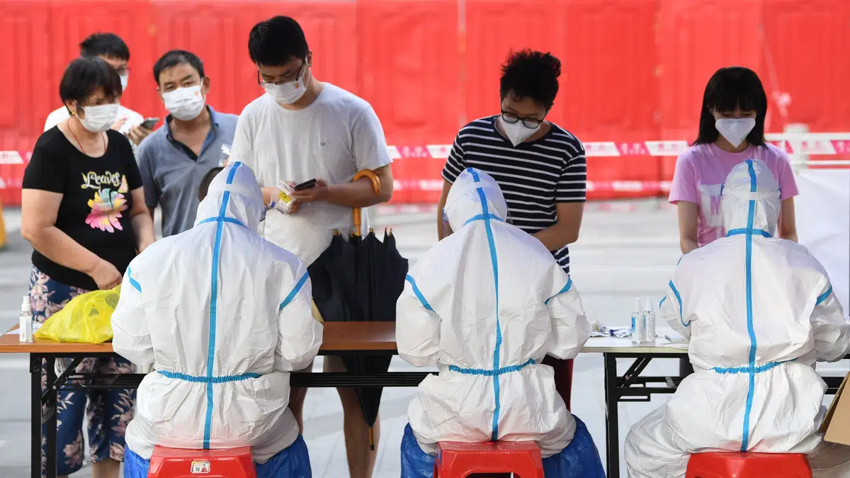 Residents from Guangzhou’s Liwan district register for Covid-19 tests as the city tries to contain an outbreak.